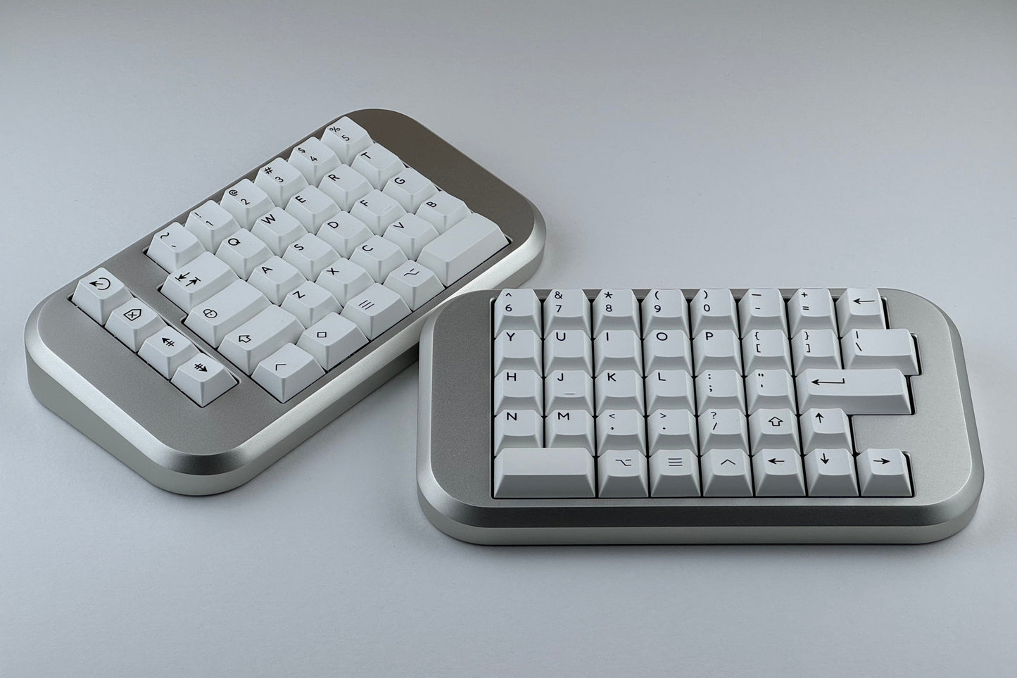 Silver Hall effect split keyboard with white keycaps, ortholinear layout for gaming