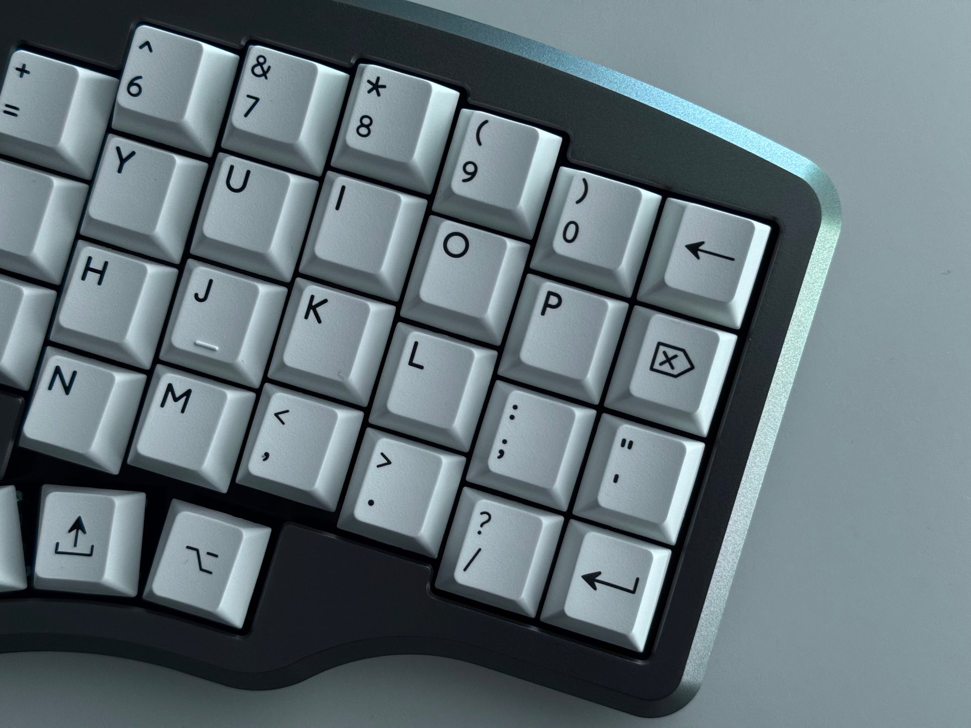 Top view of grey Hall effect split keyboard with 4x6 column staggered keys and 3 thumb keys white keycaps