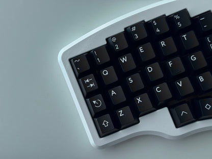 Top view of white Hall effect split keyboard with 4x6 column staggered keys and 3 thumb keys black keycaps