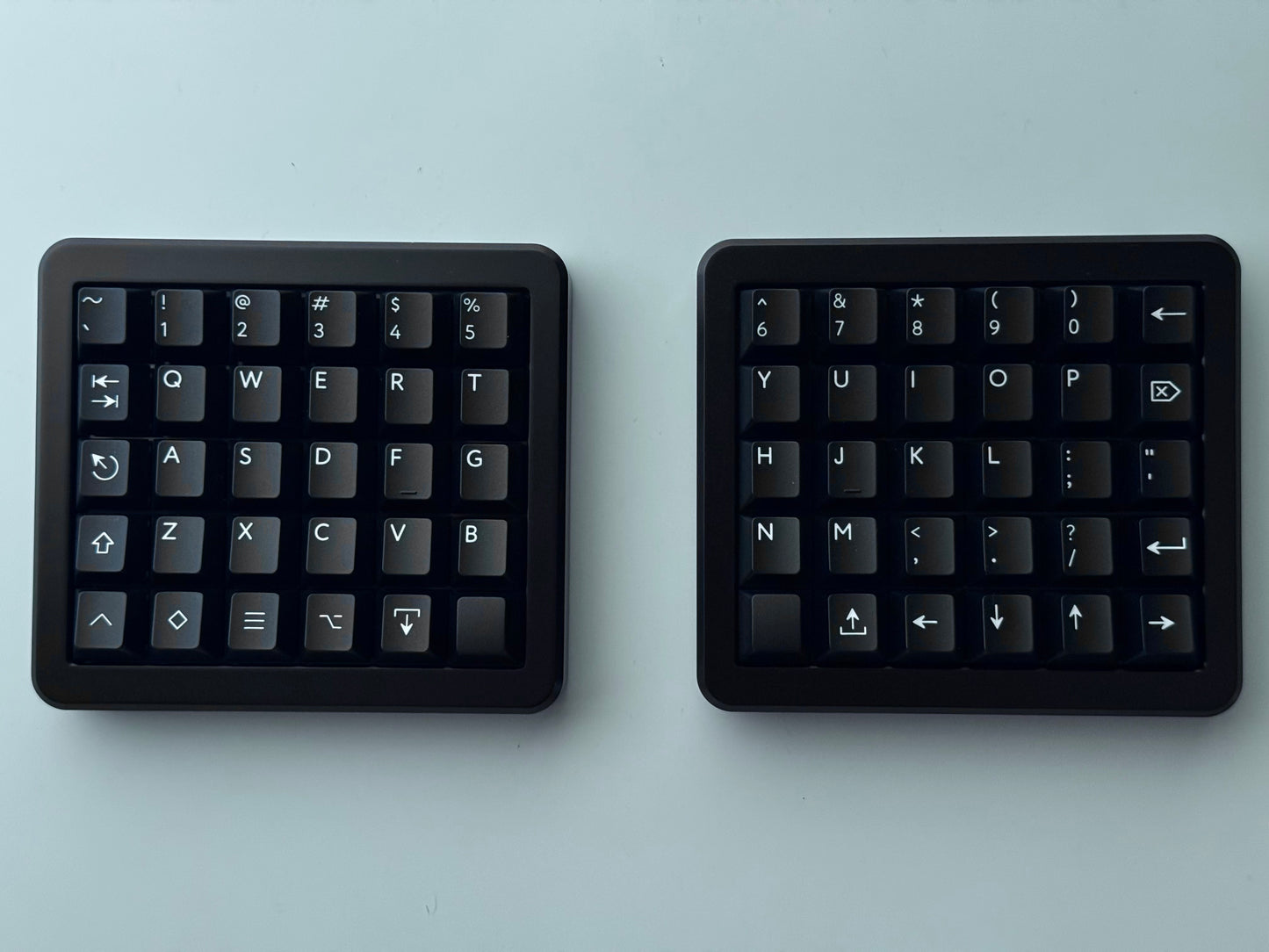 Top view of black Hall effect split keyboard 5x6 ortholinear with black keycaps